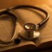A stethoscope resting on an open Bible