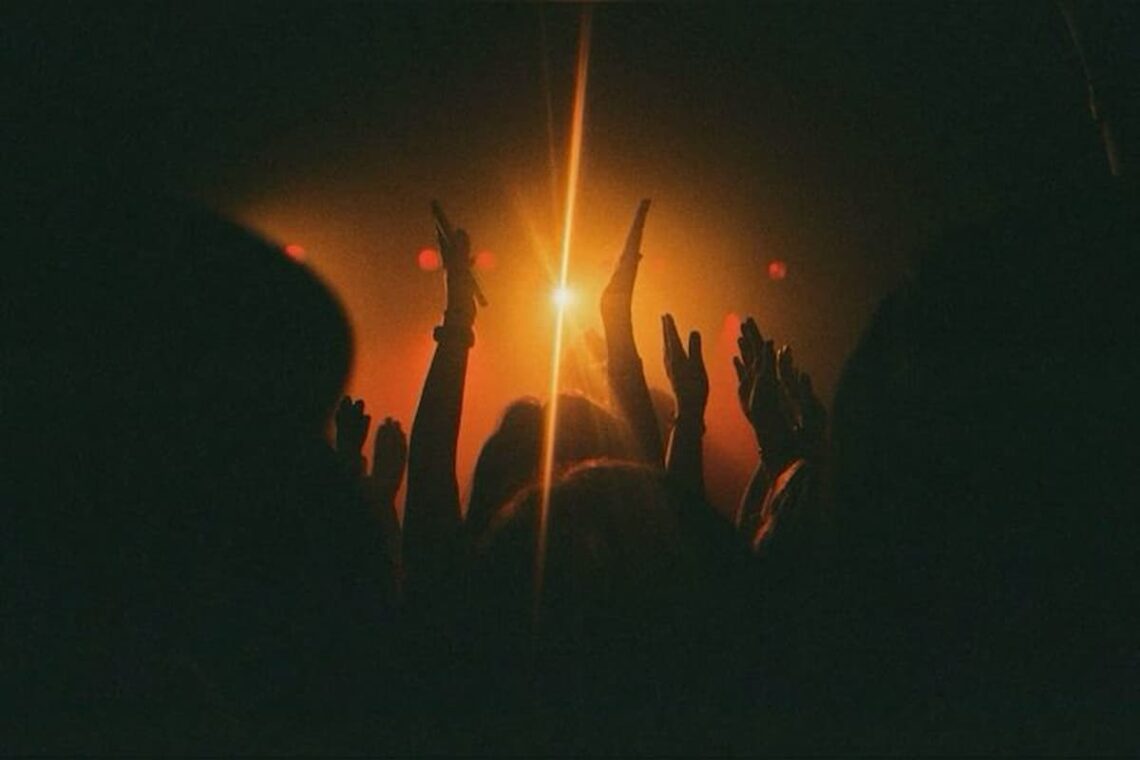 A blurred photo of people dancing at a house party, overlaid with a darker vignette (hinting at how fun turned dangerous).