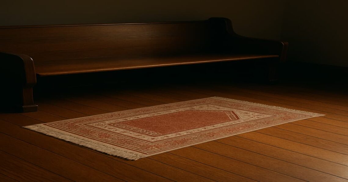 An image of an empty church pew and also a prayer mat on the floor